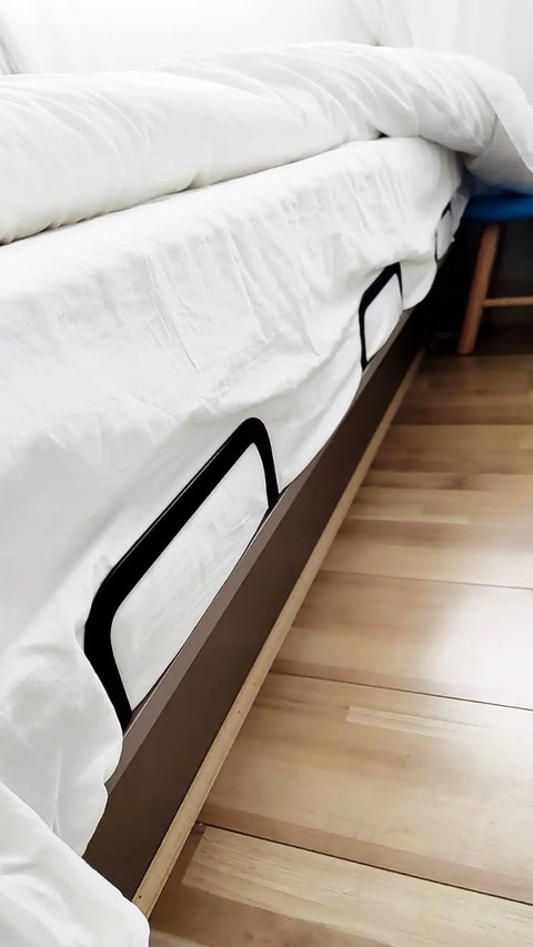 Ditch The Daily Slide, Keep Your Mattress Locked Down With These Heavy Duty Retainer Bars, Black Metal Slide Stopper Brackets For Platform And RV Beds, Easy Install Anti Slip Rails That Hold Fast, close view of brackets under bed.