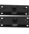 Pair of black hidden door hinge plates with central pivot rollers