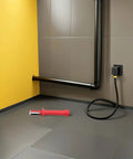 Heavy Duty Insulated Wire Stripper Knife With No Sweat Cable Cutting Razor Ergonomic Grip Handle on a floor by a wall.