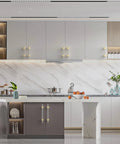 Modern kitchen with 5 Inch Brushed Satin Nickel and Gold Cabinet Handles installed on grey cabinets, showcasing two-tone finish and sleek design.
