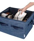 Person placing shoes in Game Changer Closet Shoe Organizer With Clear Cover And Adjustable Dividers Holds Up To 16 Pairs Navy Blue