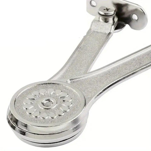 Close-up of silver hinge from 2 Pack Heavy Duty Toy Box Hinges With Soft Close Lid Support Beefed Up 50 Lb Capacity Easy Install Quiet Smooth Operation Ideal For Toy Chests Storage Boxes And DIY Furniture Projects, showing floral design detail.