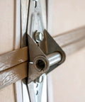 Close-up of a Six Pack Stainless Steel Garage Door Hinge with Eight Screws for Heavy Duty Weatherproof Performance and Smooth Operation