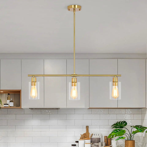 3-Light Kitchen Island Pendant Lighting in Gold Finish over modern kitchen, 31 Inch linear chandelier with clear glass shades