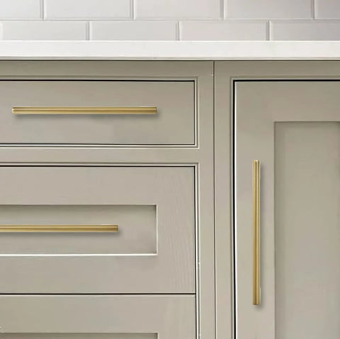 Six Pack 6 Inch Center To Center Brushed Brass Cabinet Pulls installed on kitchen drawers and cabinets showing antique style hardware.