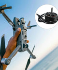 Person holding drone with focus on Brushless Alloy Drone Motor 1300KV For 7 Inch Drones, Compact Electric Motor For DIY UAV.