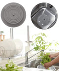 Bathtub Drain Stopper 6 Inches Silicone Rubber Plug, Black shown in kitchen sink with water, preventing spills and odors.