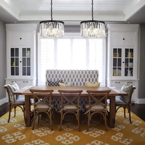 Dining room with modern black crystal chandelier lighting with K9 crystals round pendant ceiling light above wooden table.