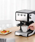 Pro Grade Commercial Semi Automatic Espresso Machine In Stainless Steel With High Pressure Steam Milk Frother Wand 20 Bar Extraction 110-240V For Busy Cafes shown on a kitchen counter with a person frothing milk.