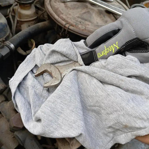 Bulk Recycled Gray T Shirt Rags 50 Lb Bag Cotton Cleaning Cloths For Garage Paint Dust Oil Wood And Multi Surface Wiping Great Absorbency For Quick Cleanup In Workshops And Industrial Environments shown with wrench