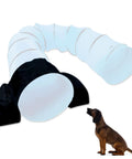 Dog agility tunnel with Saddlebag Style Sandbag, Heavy Duty PVC, 66 Inch Long, Black, shown with a dog for scale, Velcro sides visible.