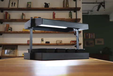 All In One Indoor Garden Kit With Dual T5HO Grow Lights And NanoTech Reflectors on wooden table