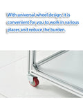 Close-up of locking caster wheel on Slick Rolling Aluminum Workbench With Locking Casters, ideal for mobility during electronics assembly.