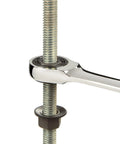 Chrome wrench in use on bolt from Ratcheting Combination Wrench Set With Roll Up Pouch, Thirteen Piece, Six Point Box End Grips