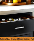 Drawer with modern brushed nickel cabinet pull and organized spices
