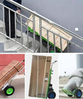 Heavy Duty Electrical Stair Climber Dolly With Brushless 1200W Motor And Removable Battery hauling boxes up stairs.