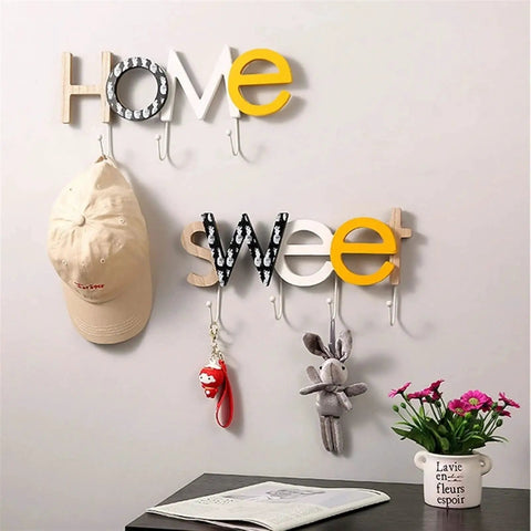 Rustic Wall Mounted Coat Hooks Solid Pine Wood Distressed Finish Super Tough Heavy Duty Multi Hook Rack For Coats Hats Keys Game Changer Bedroom Home Decor Organizer with decorative letters 'Home Sweet' and various items.