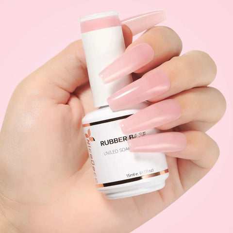 Hand holding All In One Rubber Base Gel For Nails 4 In 1 Base Coat Foundation Gel Nail Repair And Strengthener Nude Pink UV Color Nail Polish 15ml bottle