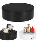 Bosgladek Motorized Rotating Display Stand with two watches, black and white spinning turntables for showcasing.