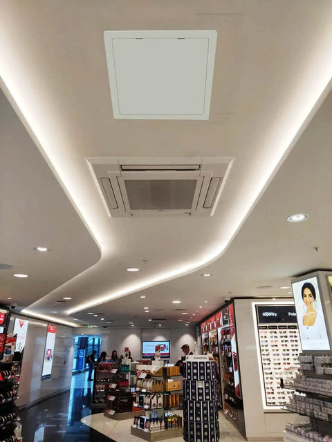 Smooth Install Plastic Access Panel And Wall Access Door For Drywall Ceilings 6 By 9 Inch installed in a commercial ceiling.