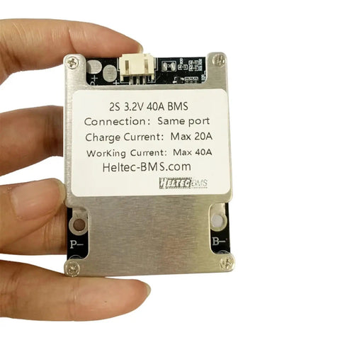 2S 40A BMS Board with active balancing for 7.4V to 8.4V, held in hand, showing connections and specifications.