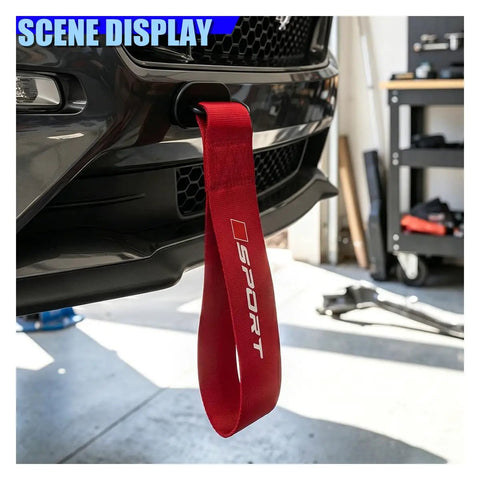 Custom Red Deco Tow Strap For Car Bumper And Trunk, Stylish Trailer Belt Plus Towing Rope Auto Exterior Bling With Abs Hook, Personalized Racing Stripe Decor That Gives Your Whip Serious Street Cred mounted on car bumper.