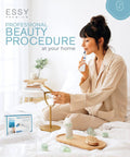 Woman using Blue Blackhead Remover Facial Cleanser Vacuum With Five Suction Levels sitting on bed with beauty products
