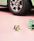 Three Piece Air Bleeder Valve Kit For Heavy Duty High Pressure Air Pumps 30 MPa Pressure Relief Screws with car tire in background.