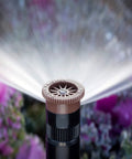 Top Shelf Adjustable Lawn Sprinkler Nozzle With 8 Ft Radius And 0 To 360 Degree Arc Movement watering garden flowers.