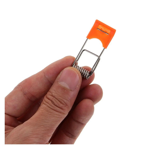 Close-up of a person holding an orange spring clip for 200 Pcs Orange Recessed Lighting Spring Clips For Panel Downlights And Ceiling Lights Rock Solid Snap Clamp Clips Heavy Duty Lamp Mounting Hardware For Secure Wobble Free Installations.