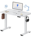 FLEXISPOT 40x24 Inch Electric Standing Desk White Ergonomic Height Adjustable Sit Stand Workstation With Memory Presets Compact Home Office Computer Table For Small Spaces Smooth Motorized Lift with monitor and accessories.