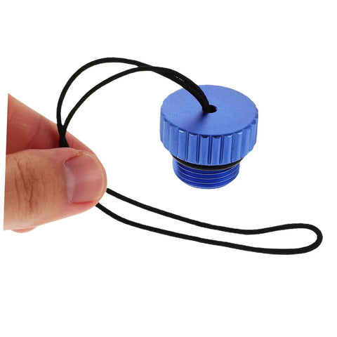 Blue aluminum dive tank valve accessory scuba valve protector cap adapter with no tools required held by hand on white background