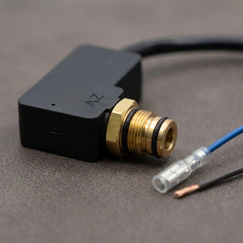 Premium Pressure Washer Switch Assembly Replacement With Pre-Stripped Wires And Durable Brass Threaded Connector In Compact Rectangular Housing showing black housing, brass connector, and pre-stripped wires.