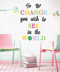 Be The Change You Wish To See In The World Wall Decals Inspirational Quote Wall Stickers colorful lettering above chairs in room