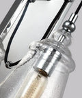 Close-up of glass fixture on Loras One Light Wall Sconce In Traditional Style With Weathered Iron Finish, 5.75 Inch Wide By 17 Inch