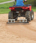 Heavy Duty Steel Drag Harrow And Field Leveler attached to ATV smoothing soil on a field