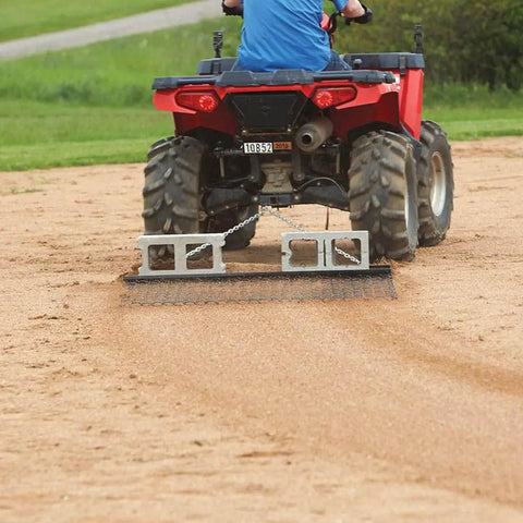 Heavy Duty Steel Drag Harrow And Field Leveler attached to ATV smoothing soil on a field