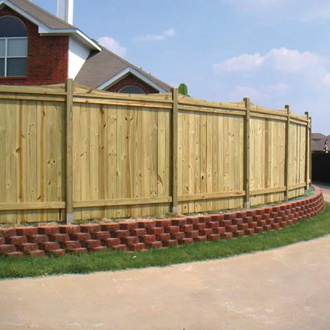 Wooden fence with Wood Fence Rail Brackets EZ Hide Two Pack For Hooking Up 2x4 Rails To 4x4 Posts With Blind Connection in a garden.