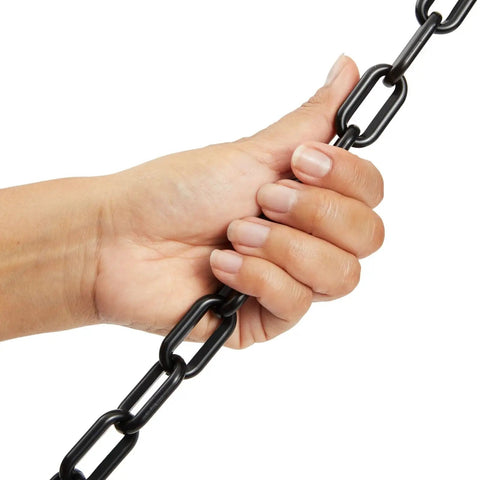 Close-up of hand holding Heavy Duty Black Plastic Chain Links 100 Ft for Safety Barriers on fences and gates, weather resistant.