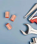 Premium Copper Coupling Fittings 0.59 Inch Straight Pipe Connectors on blue background with tools for HVAC systems.