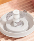 Cordless Electric Hand Mixer With Stainless Steel Beaters. USB Rechargeable power mixing blades in a gray base.