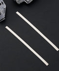 Forty Pieces White Pp Plastic Welding Rods For Car Bumper Repair Kit, two white polypropylene rods on a black surface.