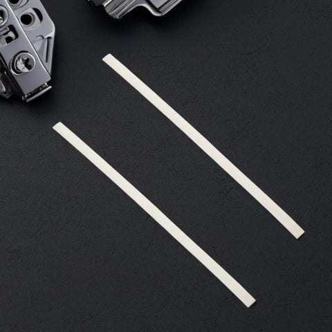 Forty Pieces White Pp Plastic Welding Rods For Car Bumper Repair Kit, two white polypropylene rods on a black surface.