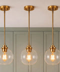 Luboyear 3 Pack Inch Clear Globe Glass Pendant Lights, Gold Brass Adjustable Height Hanging Light Fixtures for Kitchen Island, Dining Room, Hallway with clear glass shades.