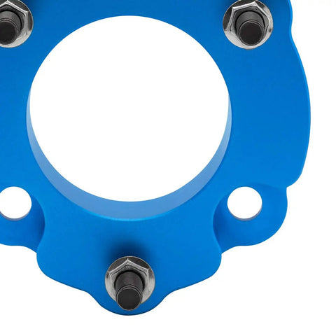 Close-up of blue Ford F-150 Raptor SVT Front Leveling Kit 2010-2017 2.5 Inch Lift Bolt On T6 Aircraft Billet strut spacer