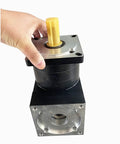 Heavy Duty Right Angle Planetary Gearbox For Nema 42 Stepper Motor 110mm Flange shown from the front with a hand on it.