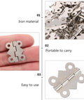 Close-up of vintage iron cabinet hinges showing iron material and butterfly shape for easy installation in cabinets.