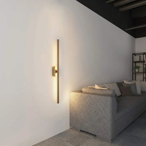 Gold Finish 39 Inch LED Wall Sconce Sleek Dope Slim Linear Light For Living Room Bedroom Hallway Foyer Corridor 14W 980 Lumens 3000K Surface Mounted Easy Install Ambient Glow illuminating a modern living room space.