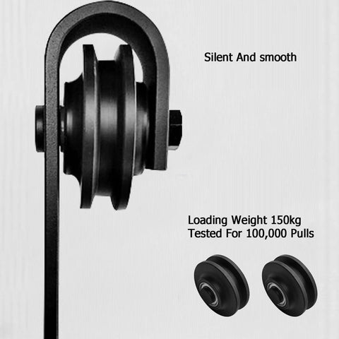 Close-up of the External Carbon Steel Barn Door Sliding Rail Kit, showcasing the wheel mechanism and black powder-coated finish.