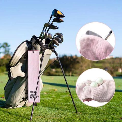 Swing Swear Repeat Embroidered Pink Golf Towel With Clip For Golf Bags hanging on a golf bag with close-ups of towel texture and pockets.